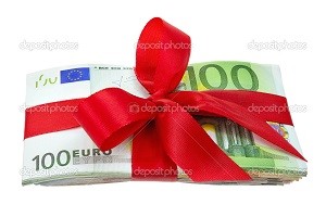 Bunch of euro banknotes neatly tied with red ribbon as a gift, isolated studio shot